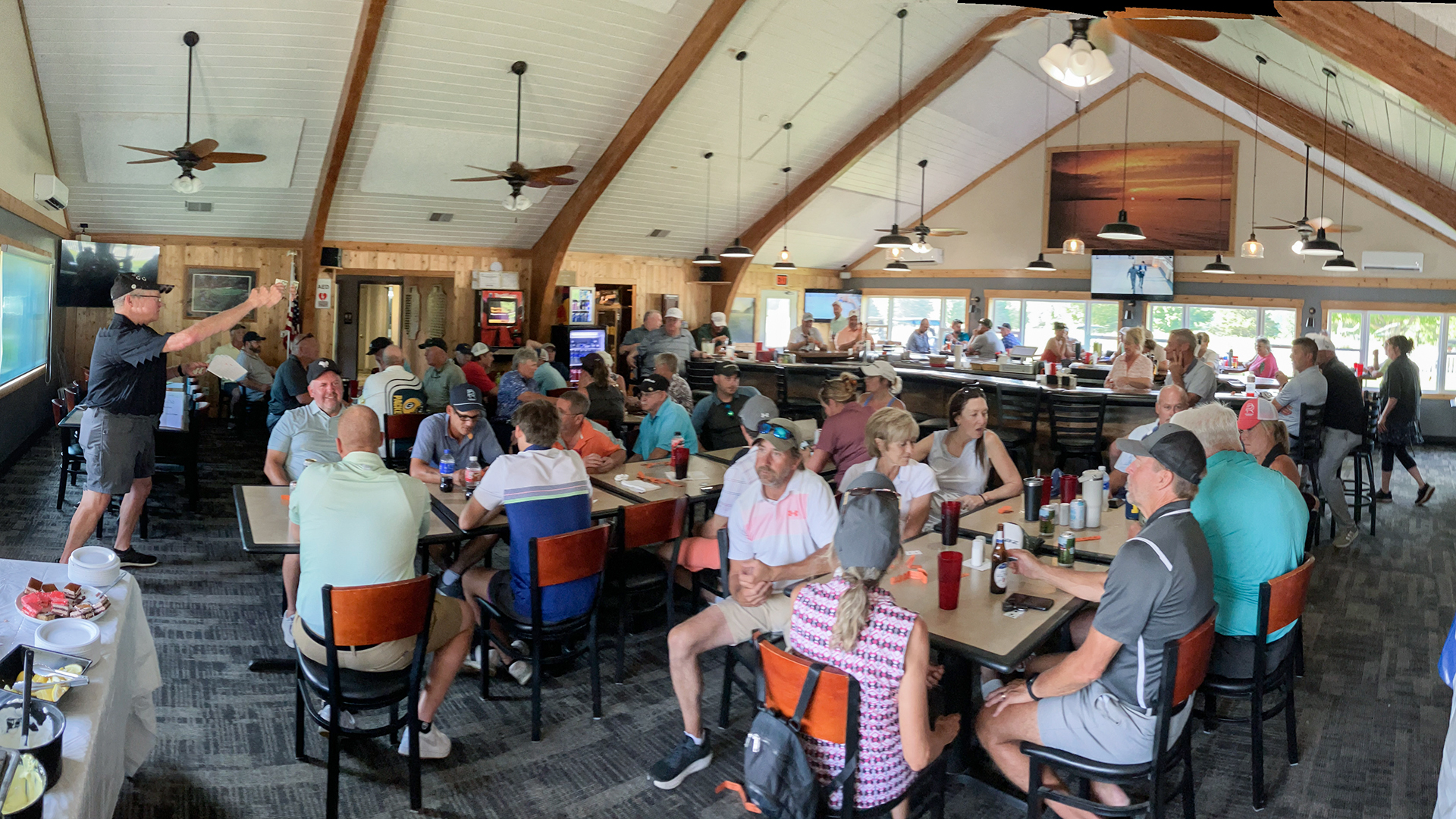 DeeJay announcing the flight winners at the Pictured Rocks Golf fundraiser.
